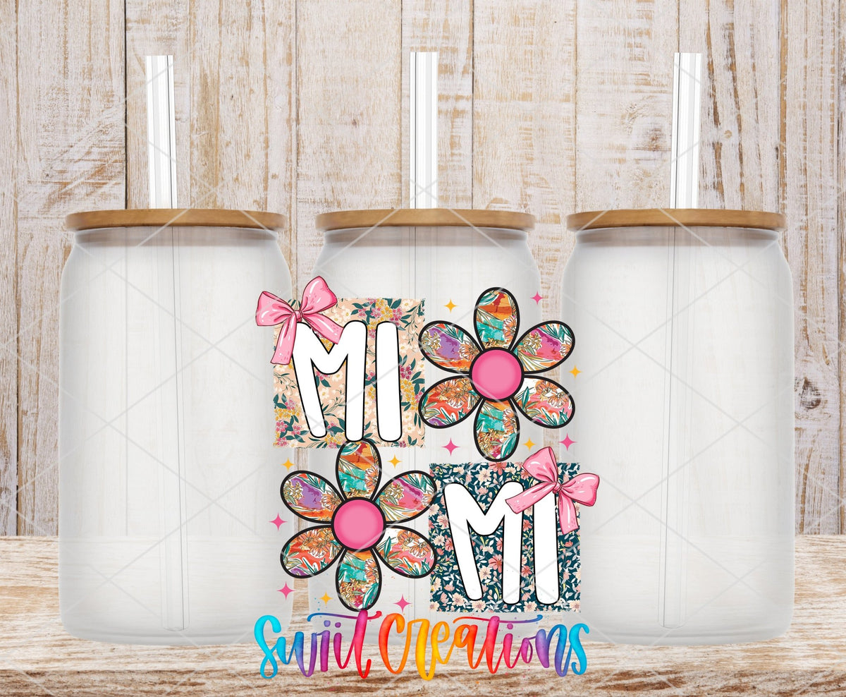 Mimi Floral Patchwork Daisy UV DTF transfer applied to a clear glass can set from Swiit Creations