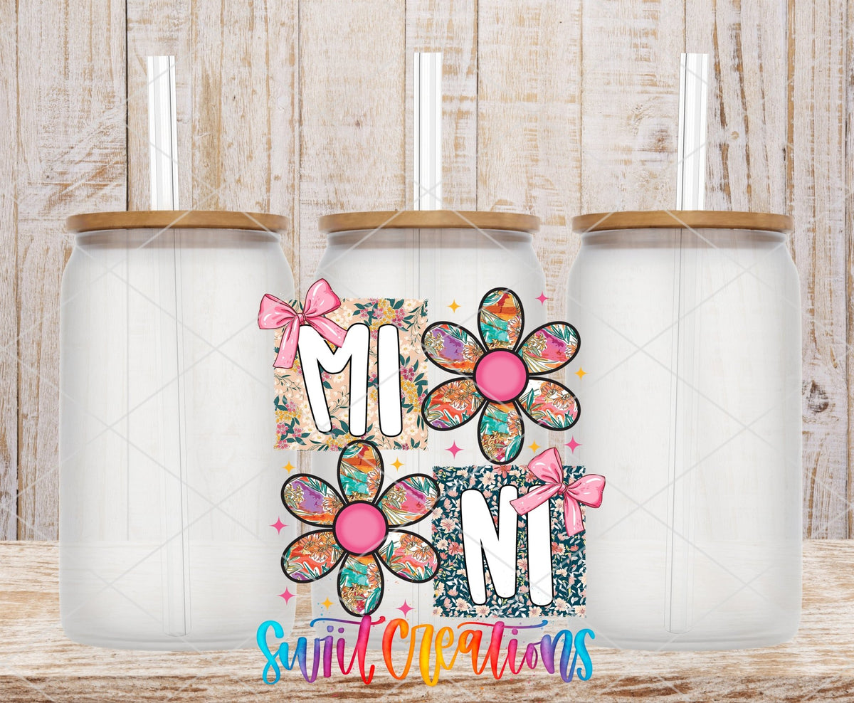Mini Floral Patchwork Daisy UV DTF transfer applied to a clear glass can set from Swiit Creations
