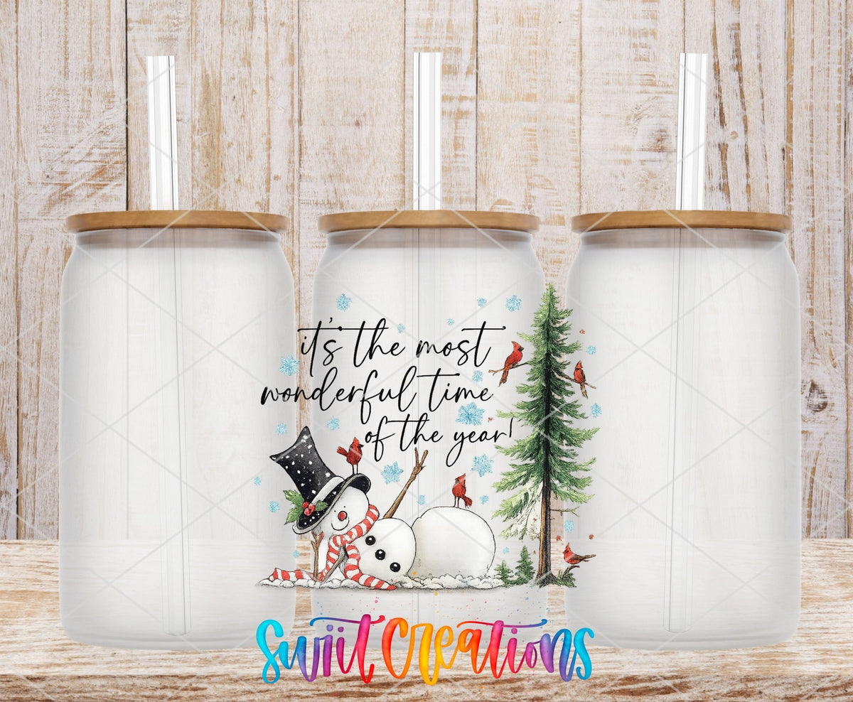 Most Wonderful Time Of The Year Snowman UV DTF transfer applied to a clear glass can set from Swiit Creations