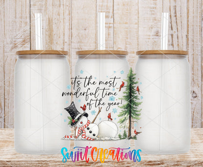 Most Wonderful Time Of The Year Snowman UV DTF transfer applied to a clear glass can set from Swiit Creations