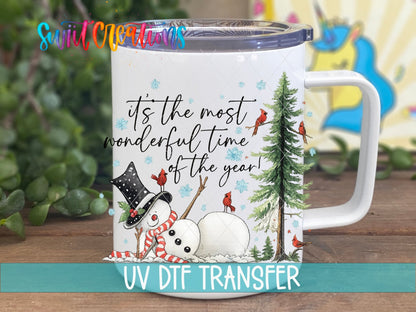 Most Wonderful Time Of The Year Snowman UV DTF transfer displayed on a white coffee mug from Swiit Creations