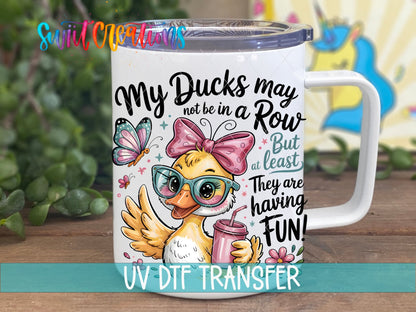 My Ducks May Not Be In A Row Funny Duck UV DTF transfer displayed on a white coffee mug from Swiit Creations