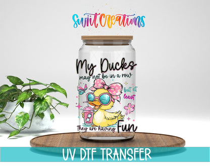 My Ducks May Not Be In A Row UV DTF transfer displayed on a clear jar mockup from Swiit Creations