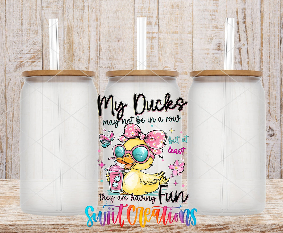 My Ducks May Not Be In A Row UV DTF transfer applied to a clear glass can set from Swiit Creations