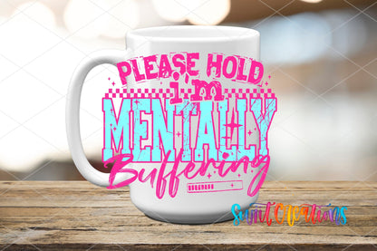 Please Hold I’m Mentally Buffering UV DTF transfer displayed on a white ceramic mug from Swiit Creations