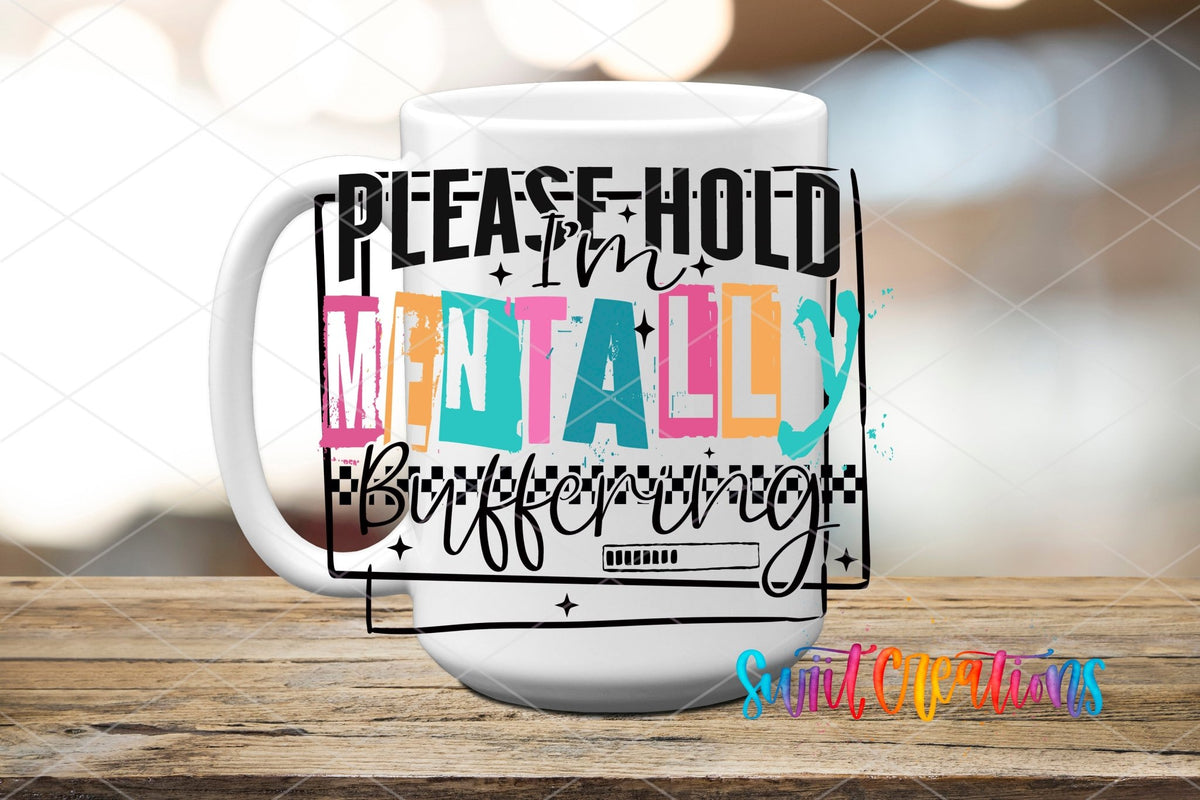 Please Hold I'm Mentally Buffering UV DTF transfer displayed on a white ceramic mug from Swiit Creations