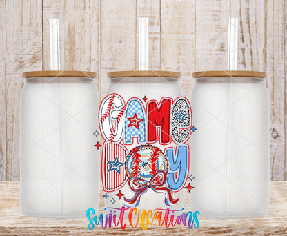 Red White and Blue Game Day Baseball UV DTF transfer applied to a clear glass can set from Swiit Creations