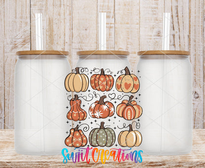 Retro Pumpkin UV DTF transfer applied to a clear glass can set from Swiit Creations