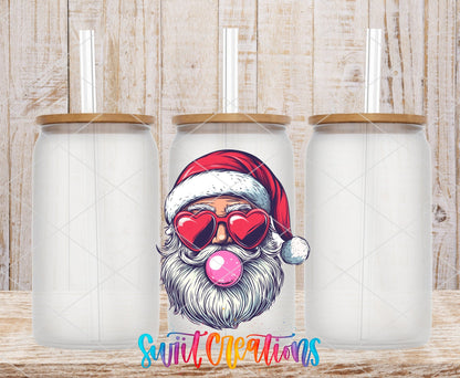 Swiit Creations UV DTF Retro Santa Heart Sunglasses Bubble Gum transfer shown on a clear glass can set