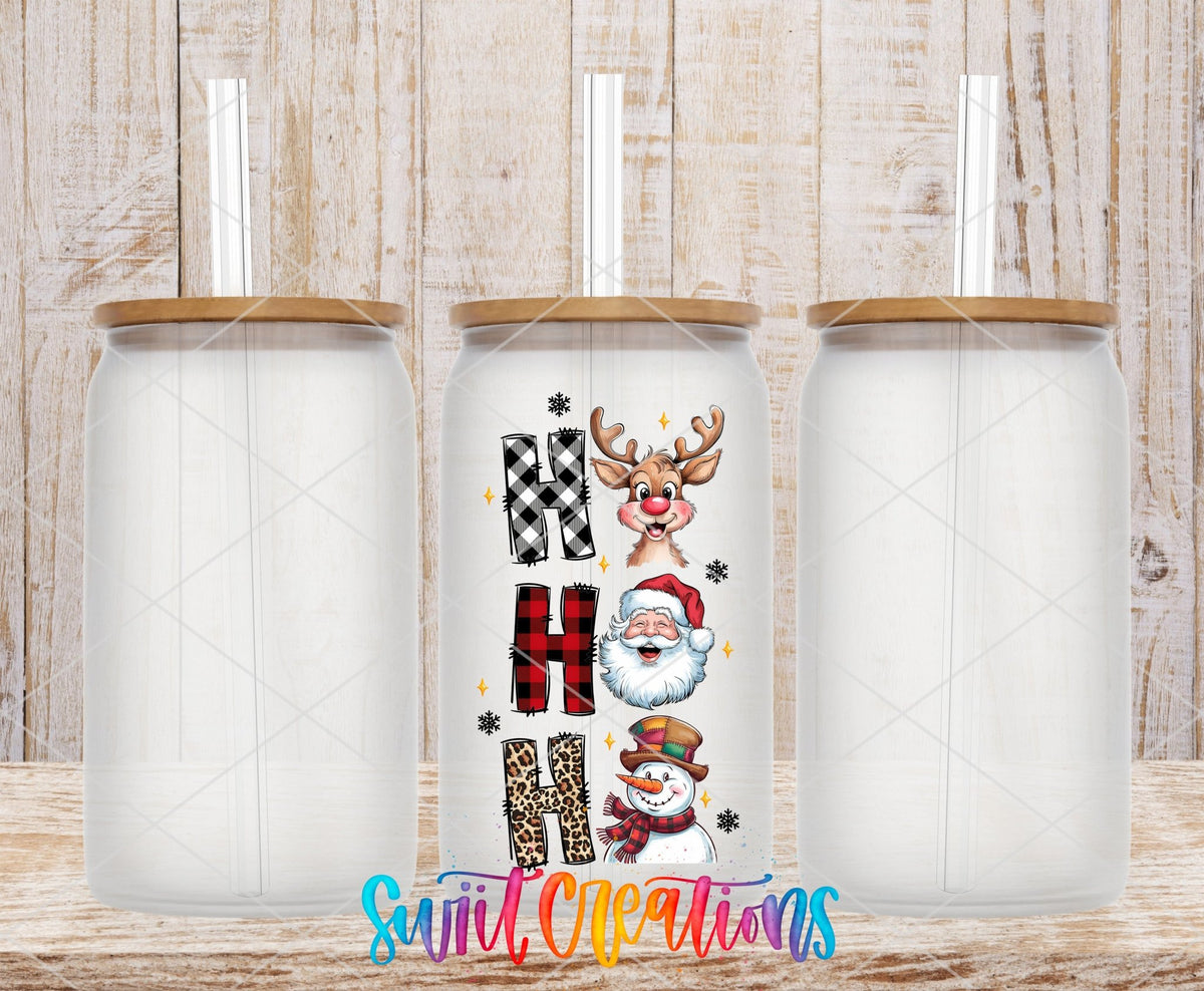 Swiit Creations UV DTF Santa Reindeer Snowman transfer shown on a clear glass can set