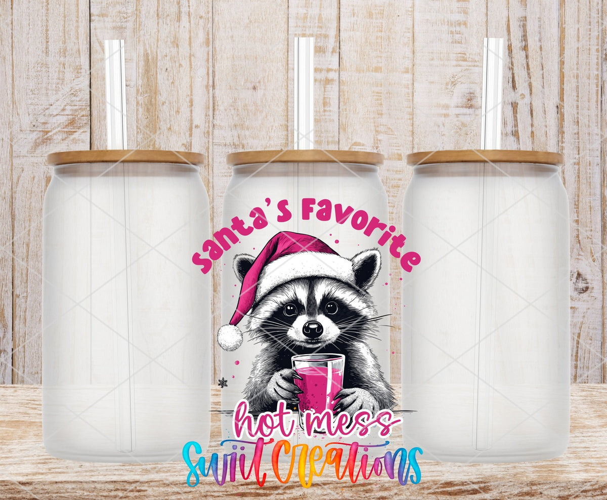 Swiit Creations UV DTF Santa’s Favorite Hot Mess Raccoon transfer shown on a clear glass can set