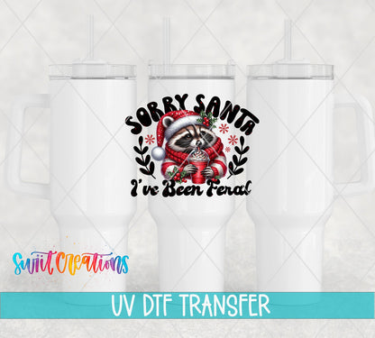 Swiit Creations UV DTF Feral Raccoon Christmas transfer shown on a white tumbler set