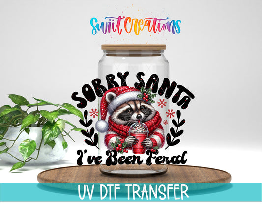 Swiit Creations UV DTF Feral Raccoon Christmas transfer displayed on a clear jar mockup