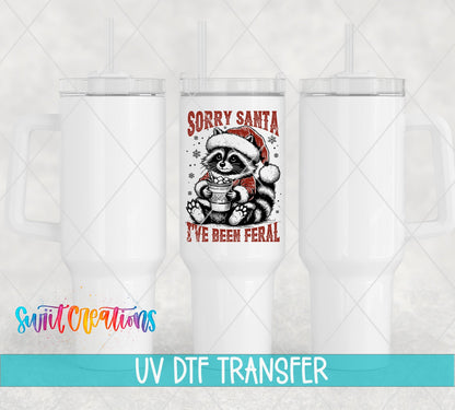 Swiit Creations UV DTF Feral Raccoon Christmas transfer shown on a white tumbler set