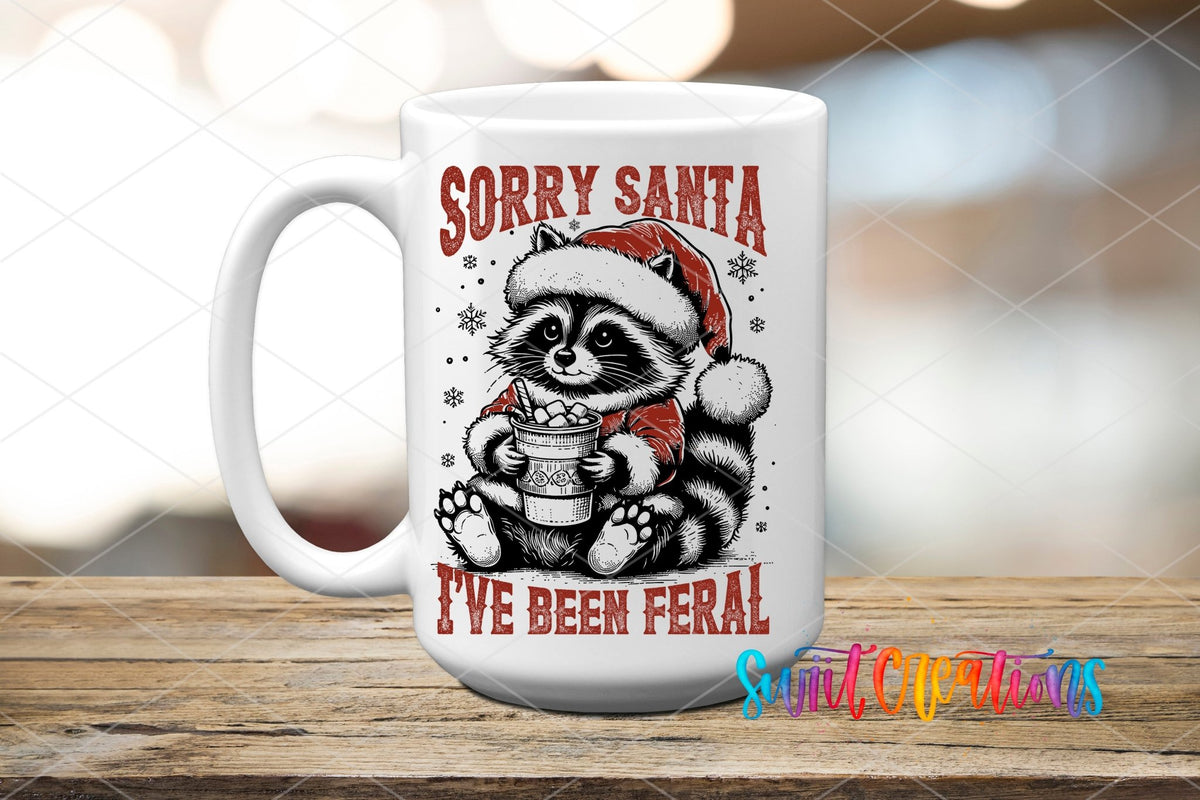 Swiit Creations UV DTF Feral Raccoon Christmas transfer applied to a white ceramic mug