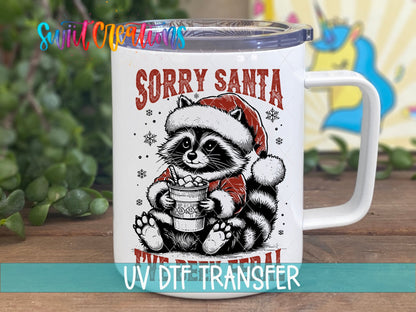 Swiit Creations UV DTF Feral Raccoon Christmas transfer displayed on a white coffee mug