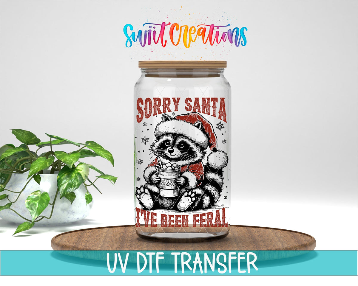 Swiit Creations UV DTF Feral Raccoon Christmas transfer displayed on a clear jar mockup