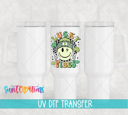 St Patricks Lucky Vibes UV DTF transfer applied to a white tumbler set from Swiit Creations
