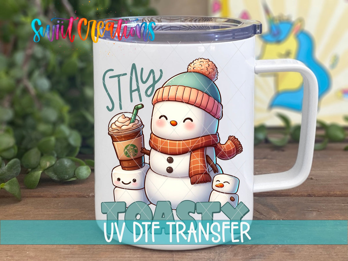 Swiit Creations UV DTF Stay Toasty Snowman Coffee Christmas transfer displayed on a white coffee mug