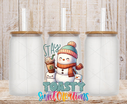 Swiit Creations UV DTF Stay Toasty Snowman Coffee Christmas transfer shown on a clear glass can set