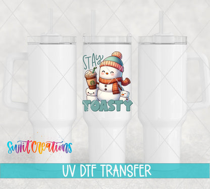 Swiit Creations UV DTF Stay Toasty Snowman Coffee Christmas transfer shown on a white tumbler set