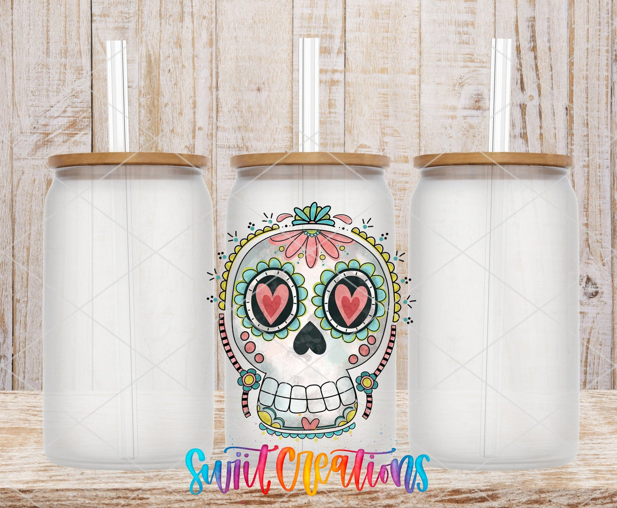 Sugar Skull Heart Eyes UV DTF transfer applied to a clear glass can set from Swiit Creations