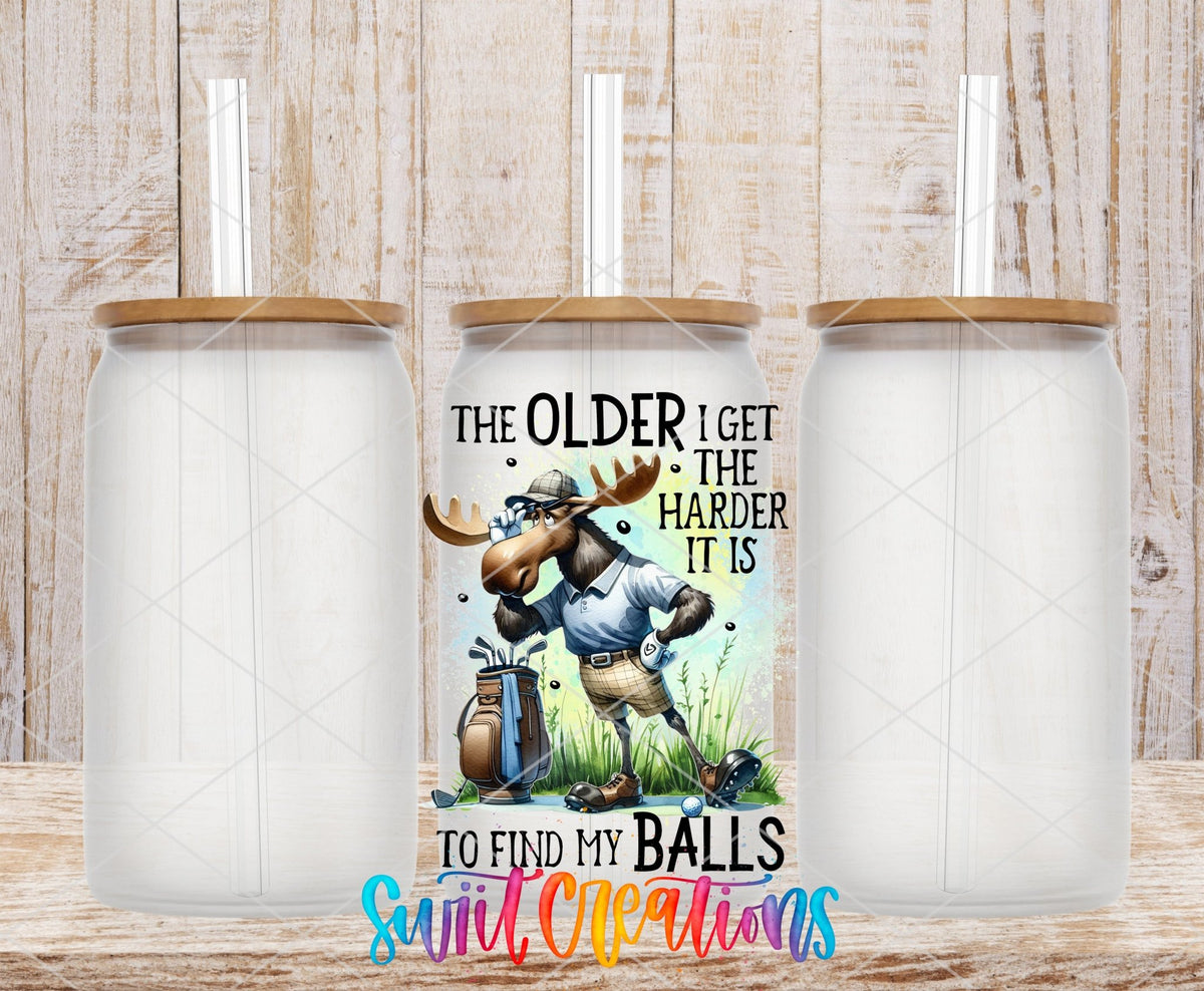 Swiit Creations UV DTF Older I Get Finding My Balls transfer shown on a clear glass can set