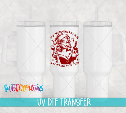 Swiit Creations UV DTF This Christmas Wine Lady transfer shown on a white tumbler set