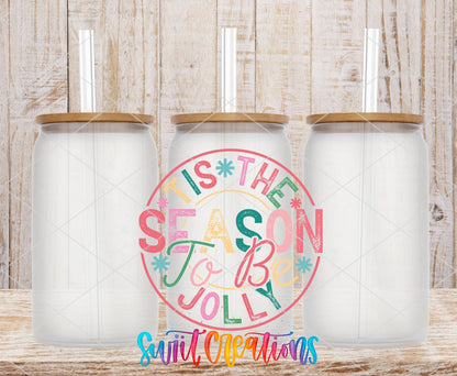 Swiit Creations UV DTF Tis the Season to Be Jolly Christmas transfer shown on a clear glass can set