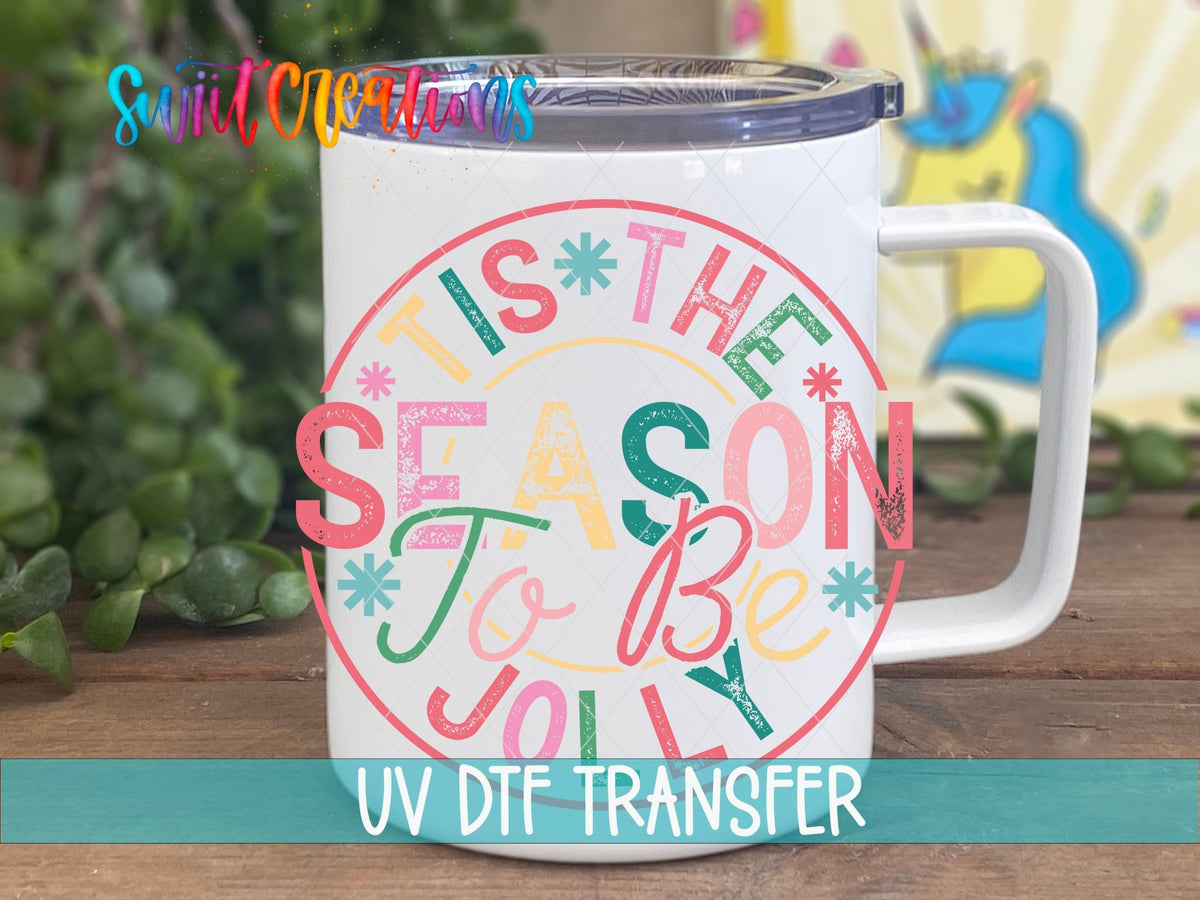 Swiit Creations UV DTF Tis the Season to Be Jolly Christmas transfer displayed on a white coffee mug