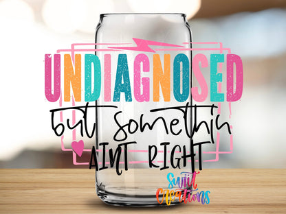 Undiagnosed But Somethin' Ain't Right UV DTF transfer applied to a clear glass can from Swiit Creations