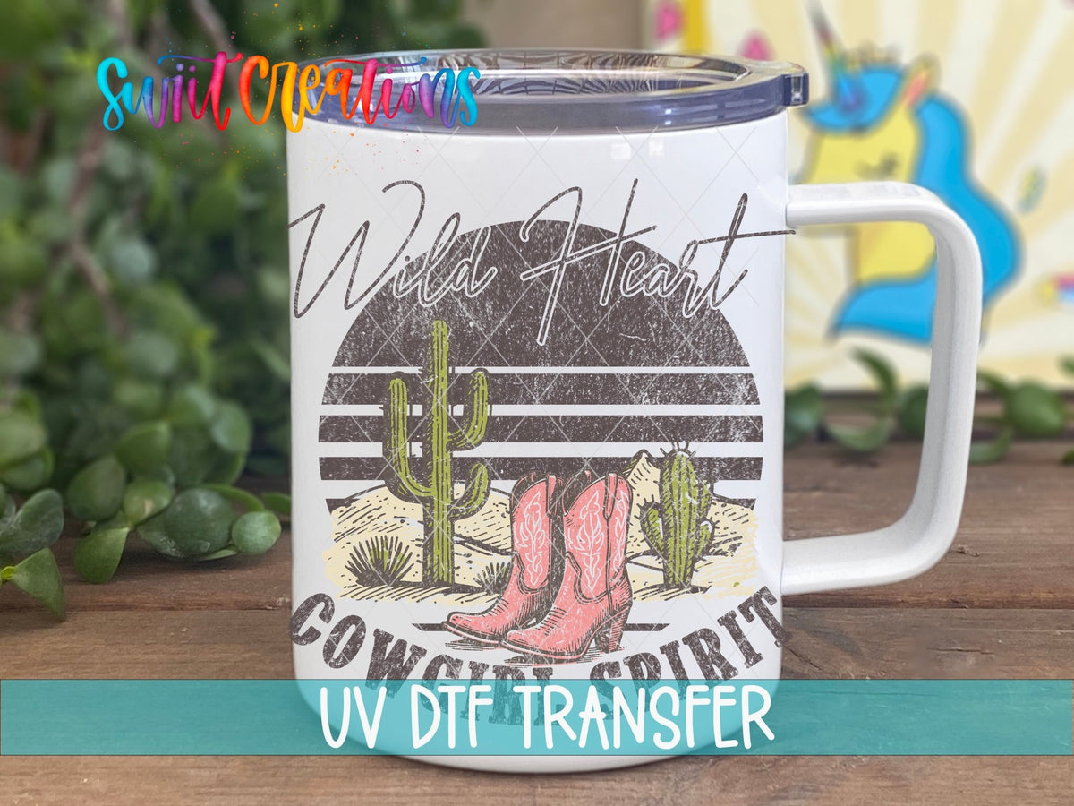 Wild Heart Cowgirl Spirit UV DTF transfer displayed on a white coffee mug from Swiit Creations